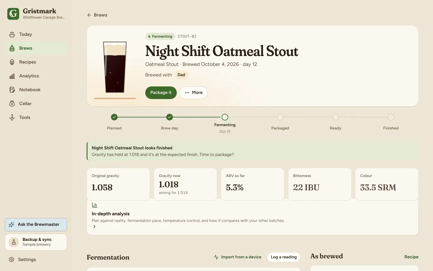 A fermenting brew with its gravity and temperature readings.